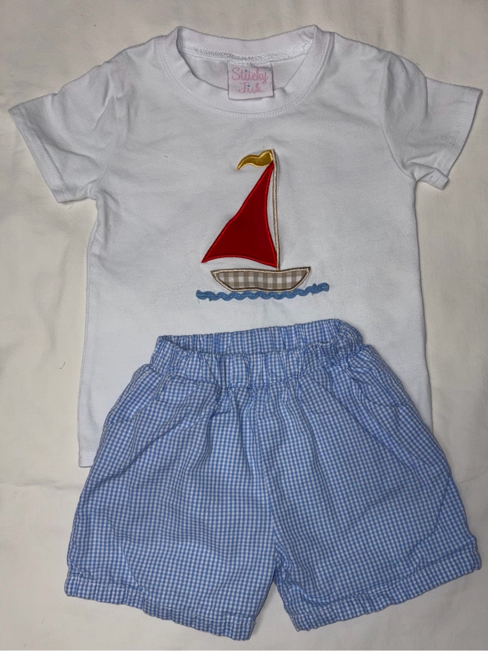Stitchy Fish tee with sailboat applique and blue checked shorts sz 18 mo EUC